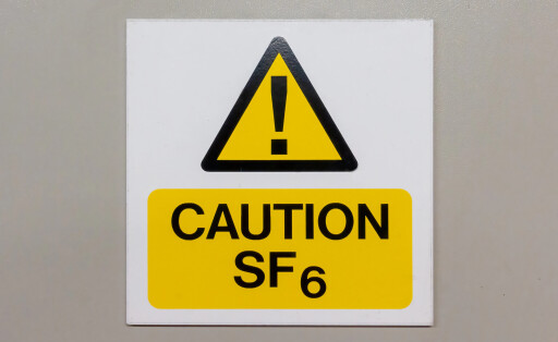 aution Sulphur Hexafluoride sign on a grey background