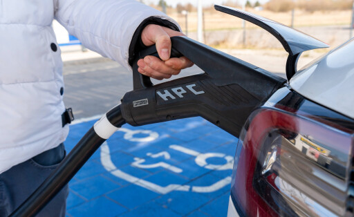 Erkheim, Bavaria, Germany - March 10, 2026: A hand connects an electric car to a fast-charging plug. The photo shows how easy it is to use modern charging technology in everyday life for climate-friendly mobility.